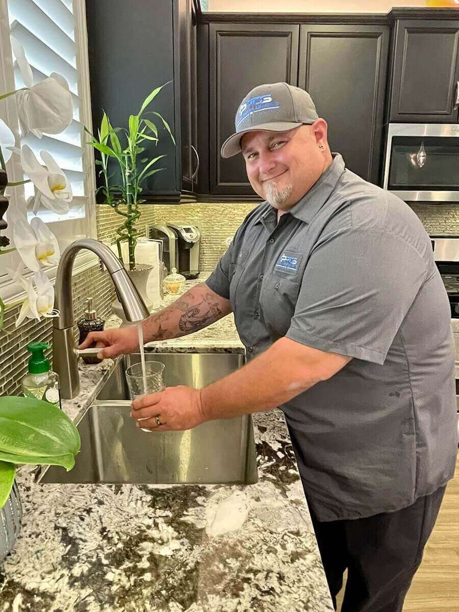 plumber pouring a glass of water