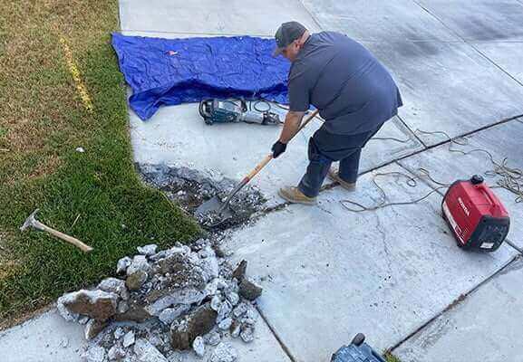 plumber performing trenchless water line repairs