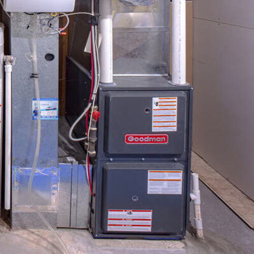 a furnace sitting in a utility room